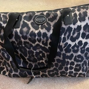 Coach fabric animal print overnight bag.
